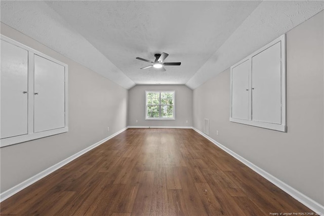 107 Beaumont Ct, Raeford, NC 28376 - additional living space featuring vaulted ceiling, dark wood-style floors, a ceiling fan, and baseboards
