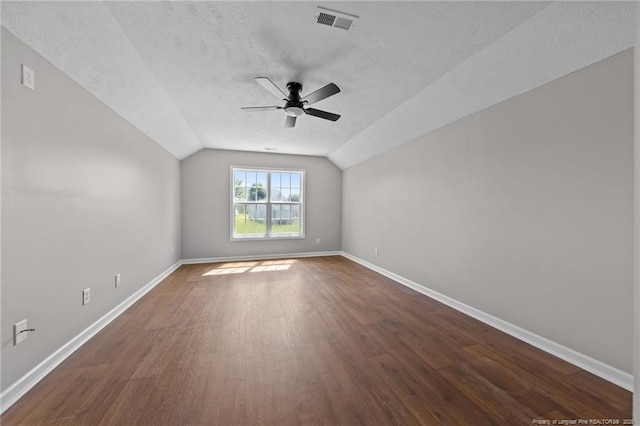 107 Beaumont Ct, Raeford, NC 28376 - unfurnished room featuring a ceiling fan, dark wood finished floors, baseboards, lofted ceiling, and a textured ceiling