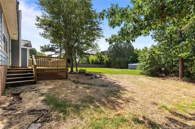 107 Beaumont Ct, Raeford, NC 28376 - view of green lawn featuring a wooden deck