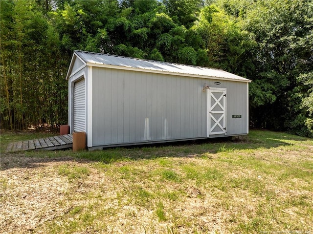 107 Beaumont Ct, Raeford, NC 28376 - view of outdoor structure featuring a wooded view