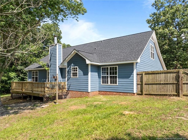 107 Beaumont Ct, Raeford, NC 28376 - back of property with a deck, roof with shingles, and a chimney