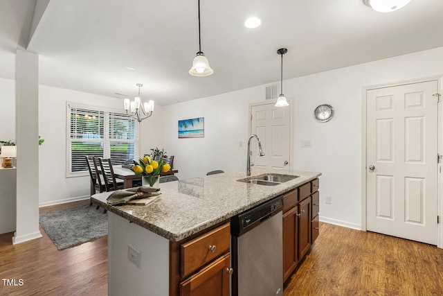 131 Abacos Ct, Clayton, NC 27520 - kitchen featuring dishwasher, wood finished floors, decorative light fixtures, a chandelier, and light stone countertops