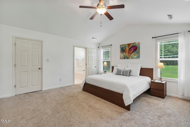 131 Abacos Ct, Clayton, NC 27520 - carpeted bedroom with lofted ceiling, multiple windows, ensuite bathroom, and a ceiling fan