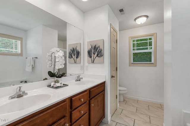 131 Abacos Ct, Clayton, NC 27520 - full bath with double vanity and healthy amount of natural light
