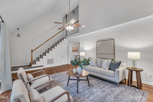 8 Great Oak Ct, Durham, NC 27713 - living area with high vaulted ceiling, stairway, wood finished floors, and ceiling fan