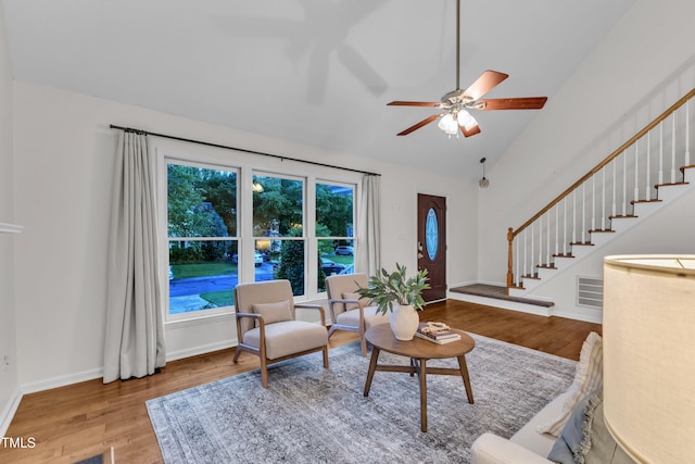 8 Great Oak Ct, Durham, NC 27713 - living area with wood finished floors, lofted ceiling, stairway, and a ceiling fan