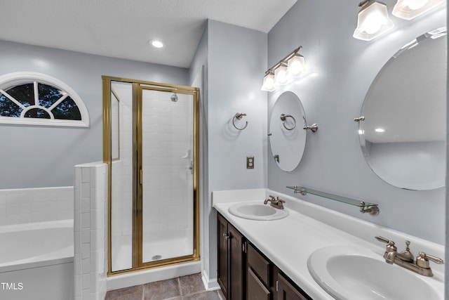 8 Great Oak Ct, Durham, NC 27713 - full bath featuring a garden tub, a stall shower, double vanity, recessed lighting, and tile patterned flooring