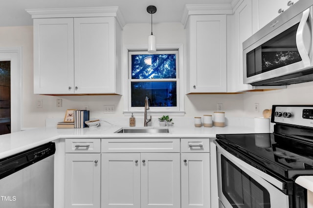 8 Great Oak Ct, Durham, NC 27713 - kitchen with stainless steel appliances, white cabinetry, light countertops, and pendant lighting