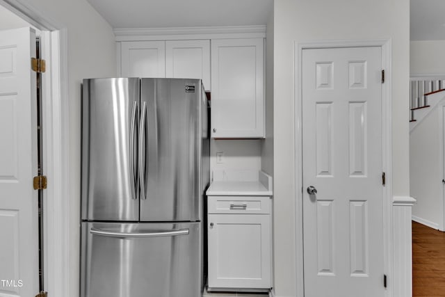 8 Great Oak Ct, Durham, NC 27713 - kitchen featuring freestanding refrigerator, white cabinetry, wood finished floors, and light countertops