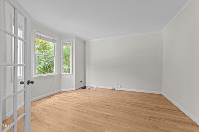 6008 Chittim Ct, Raleigh, NC 27616 - spare room featuring crown molding, light wood finished floors, baseboards, and french doors
