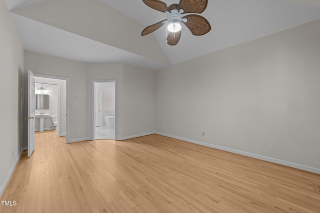 6008 Chittim Ct, Raleigh, NC 27616 - unfurnished bedroom with lofted ceiling, light wood-type flooring, connected bathroom, and baseboards
