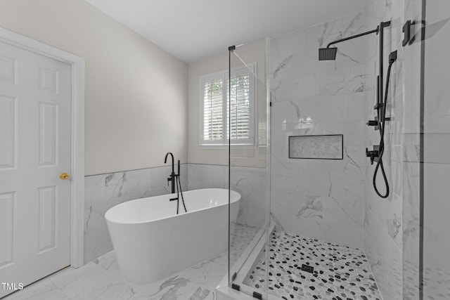 6008 Chittim Ct, Raleigh, NC 27616 - full bath with a freestanding bath, a marble finish shower, marble look tiles, wainscoting, and tile walls