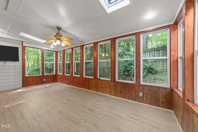 6008 Chittim Ct, Raleigh, NC 27616 - unfurnished sunroom featuring a skylight, wooden walls, and wood finished floors