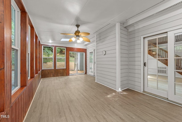 6008 Chittim Ct, Raleigh, NC 27616 - unfurnished sunroom with wood walls, a ceiling fan, wood finished floors, and french doors