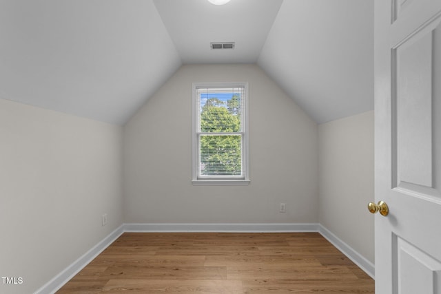 6008 Chittim Ct, Raleigh, NC 27616 - bonus room featuring light wood finished floors, vaulted ceiling, and baseboards