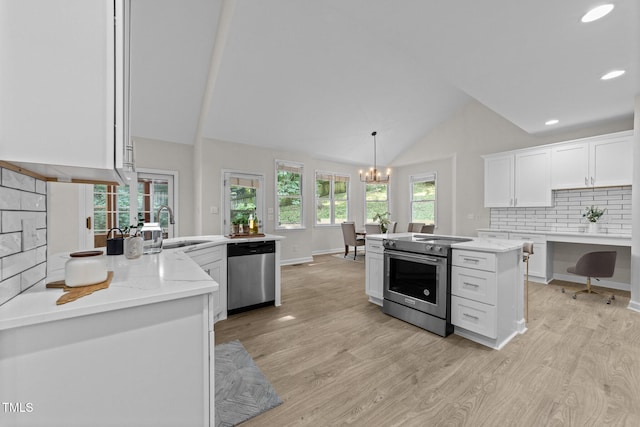 6008 Chittim Ct, Raleigh, NC 27616 - kitchen with appliances with stainless steel finishes, light wood finished floors, a sink, white cabinetry, and high vaulted ceiling