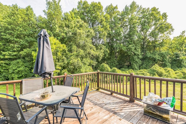 54 Lockwood Dr, Clayton, NC 27527 - deck featuring outdoor dining area and a lawn