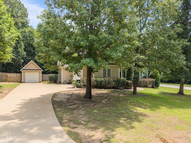44 Supreme Dr, Lillington, NC 27546 - obstructed view of property with driveway and a garage