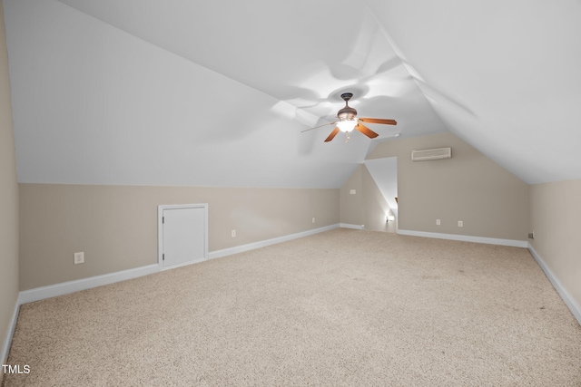 44 Supreme Dr, Lillington, NC 27546 - additional living space with carpet floors, vaulted ceiling, a wall mounted AC, and a ceiling fan