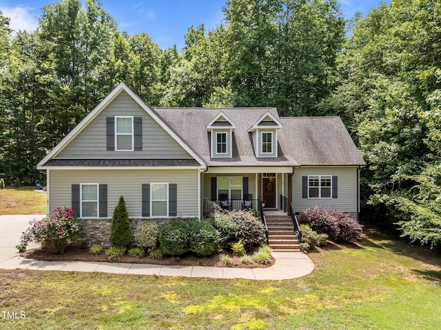 45 Chaucer Ct W, Zebulon, NC 27597 - view of front facade with stairway, a porch, a front lawn, and a shingled roof