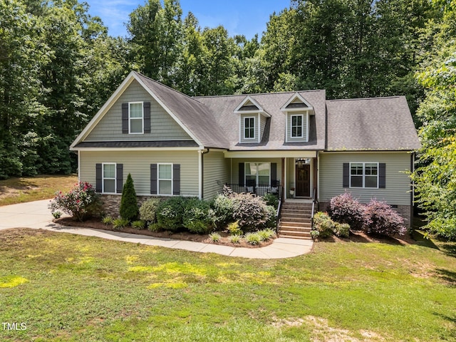 45 Chaucer Ct W, Zebulon, NC 27597 - view of front of home with a porch, a front yard, stairs, and roof with shingles