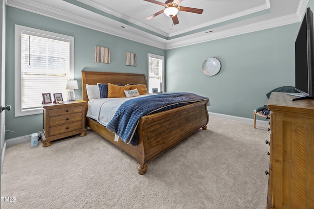 45 Chaucer Ct W, Zebulon, NC 27597 - bedroom featuring a tray ceiling, baseboards, crown molding, carpet, and a ceiling fan