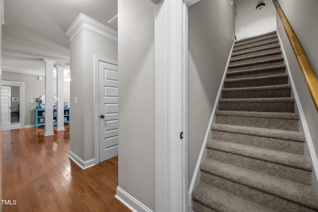 45 Chaucer Ct W, Zebulon, NC 27597 - stairway with crown molding, hardwood / wood-style flooring, decorative columns, and baseboards