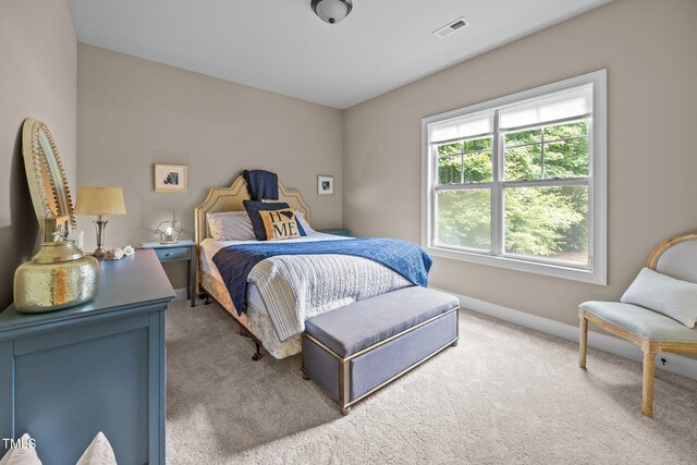 45 Chaucer Ct W, Zebulon, NC 27597 - carpeted bedroom featuring baseboards