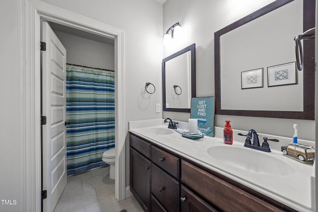45 Chaucer Ct W, Zebulon, NC 27597 - bathroom with toilet, double vanity, tile patterned floors, and a shower with curtain
