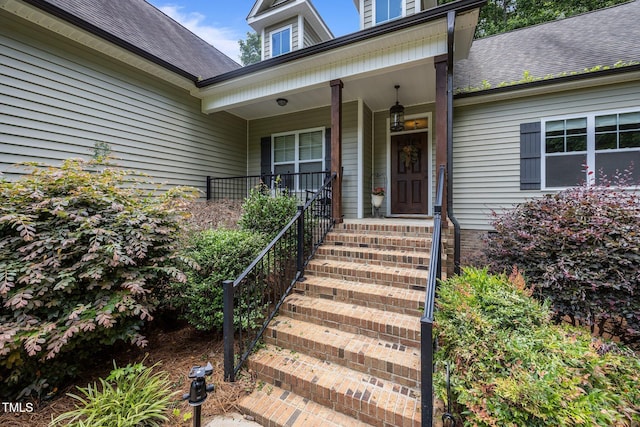 45 Chaucer Ct W, Zebulon, NC 27597 - property entrance with covered porch and a shingled roof