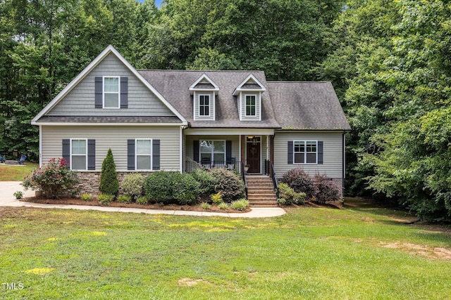 45 Chaucer Ct W, Zebulon, NC 27597 - view of front of home with covered porch, a front yard, stairway, and roof with shingles
