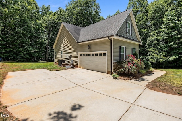 45 Chaucer Ct W, Zebulon, NC 27597 - view of home's exterior with roof with shingles, a yard, an attached garage, driveway, and cooling unit