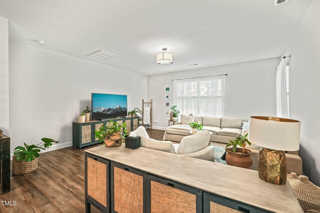 947 Weatherby Ln, Creedmoor, NC 27522 - living area with dark wood-style flooring and baseboards