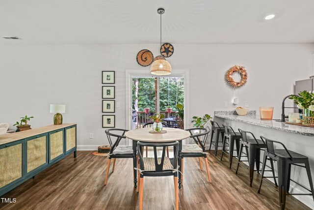 947 Weatherby Ln, Creedmoor, NC 27522 - dining area with dark wood-style flooring and recessed lighting
