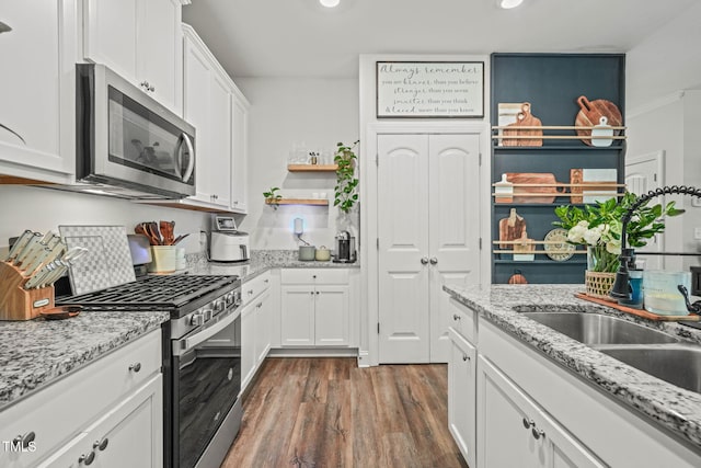 947 Weatherby Ln, Creedmoor, NC 27522 - kitchen featuring appliances with stainless steel finishes, dark wood-type flooring, white cabinets, recessed lighting, and open shelves