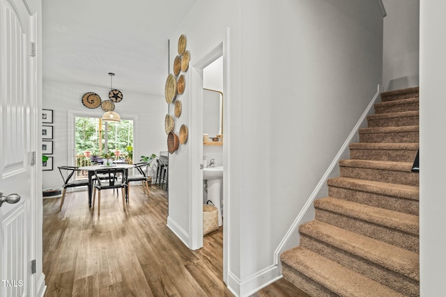 947 Weatherby Ln, Creedmoor, NC 27522 - staircase featuring wood finished floors and baseboards
