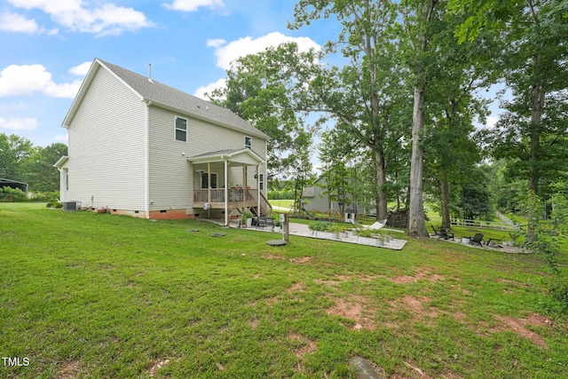 947 Weatherby Ln, Creedmoor, NC 27522 - rear view of house with crawl space, a patio area, and a lawn