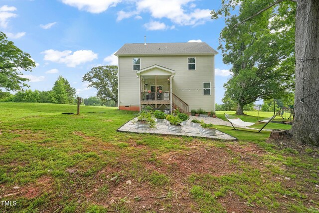 947 Weatherby Ln, Creedmoor, NC 27522 - back of house with a patio, a yard, and a deck