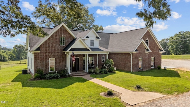 975 Paschall Rd, Warrenton, NC 27589 - view of front of home with brick siding, a front lawn, and a shingled roof