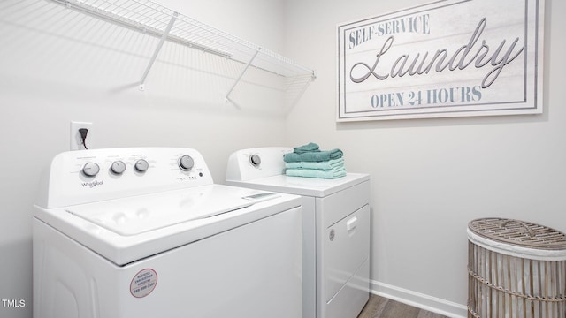 3618 Sorda Ct, Raleigh, NC 27610 - laundry area featuring separate washer and dryer, dark wood-type flooring, and baseboards