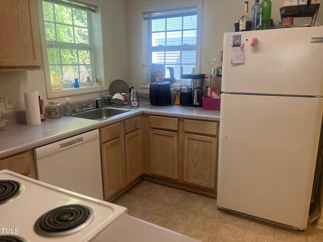 2000 University Woods Rd Unit 203, Raleigh, NC 27603 - kitchen featuring white appliances, a sink, light countertops, and light tile patterned floors