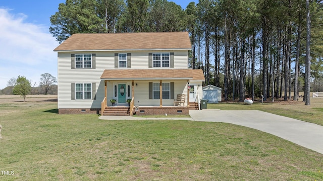 317 Hunters Creek Dr, Goldsboro, NC 27534 - view of front facade with crawl space, covered porch, a front yard, concrete driveway, and an outdoor structure