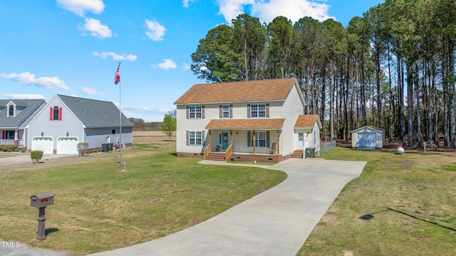 317 Hunters Creek Dr, Goldsboro, NC 27534 - view of front facade featuring crawl space, a porch, driveway, a front yard, and a detached garage