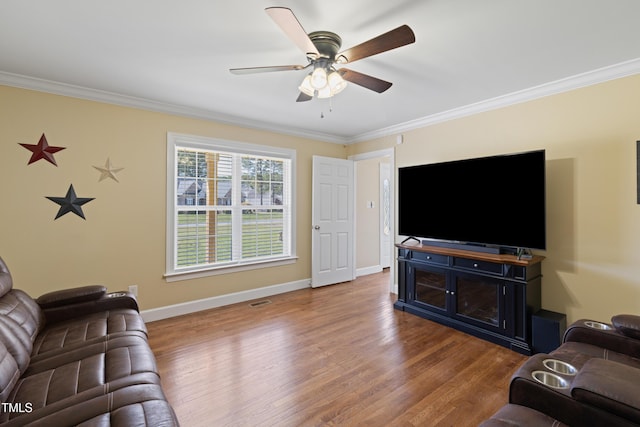 317 Hunters Creek Dr, Goldsboro, NC 27534 - living room featuring crown molding, a ceiling fan, wood finished floors, and baseboards