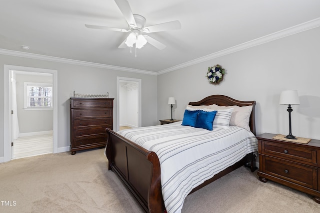 317 Hunters Creek Dr, Goldsboro, NC 27534 - bedroom featuring ornamental molding, light carpet, baseboards, and a ceiling fan
