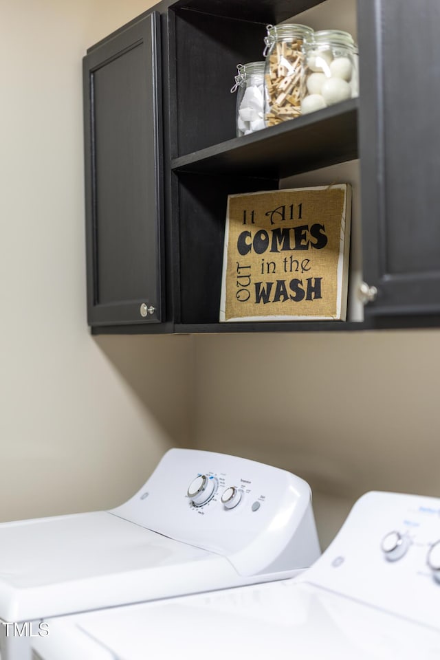 317 Hunters Creek Dr, Goldsboro, NC 27534 - laundry room with washer and clothes dryer and cabinet space