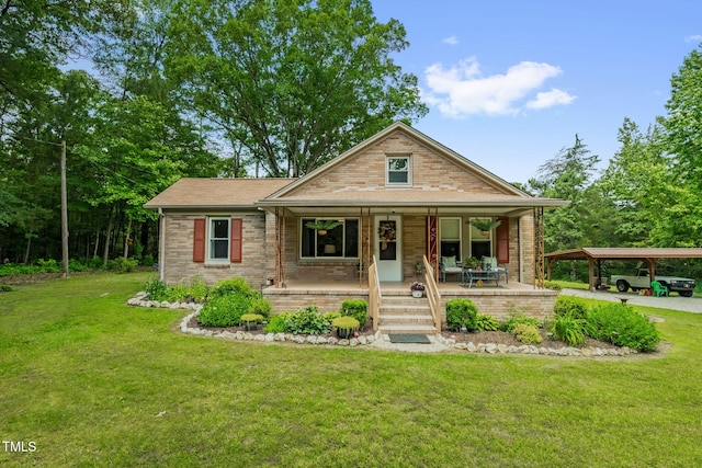 3315 Mebane Oaks Rd, Mebane, NC 27302 - bungalow-style home featuring a porch, a front lawn, brick siding, and a detached carport