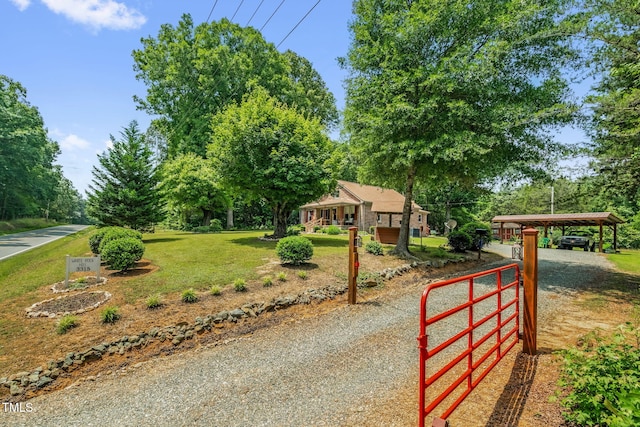 3315 Mebane Oaks Rd, Mebane, NC 27302 - view of front of property featuring a carport, a front yard, and view of scattered trees