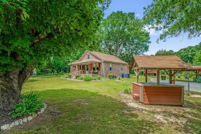 3315 Mebane Oaks Rd, Mebane, NC 27302 - view of grassy yard with a porch and central AC unit