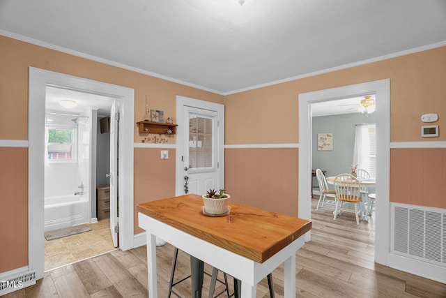 3315 Mebane Oaks Rd, Mebane, NC 27302 - dining space with ornamental molding and light wood finished floors